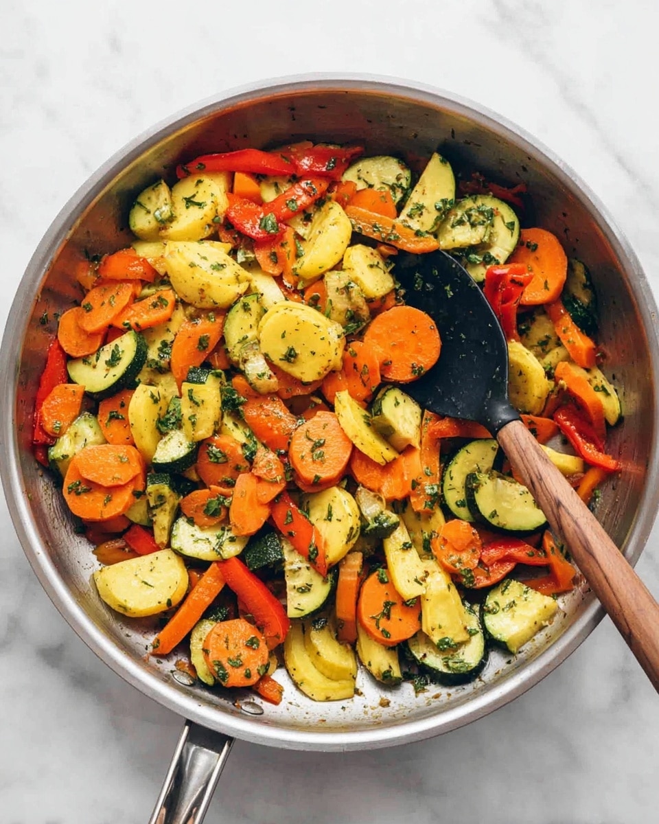 A silver pan filled with three layers of cooked vegetables on a white marbled surface: the bottom layer contains sliced yellow squash with a soft bright yellow color, the middle layer has round, smooth carrot slices in orange, and the top layer includes green zucchini slices with a dark green skin and red bell pepper strips. The vegetables are lightly tossed with small green herbs and black pepper flakes scattered over them for texture and color contrast, creating a vibrant look. Photo taken with an iphone --ar 4:5 --v 7