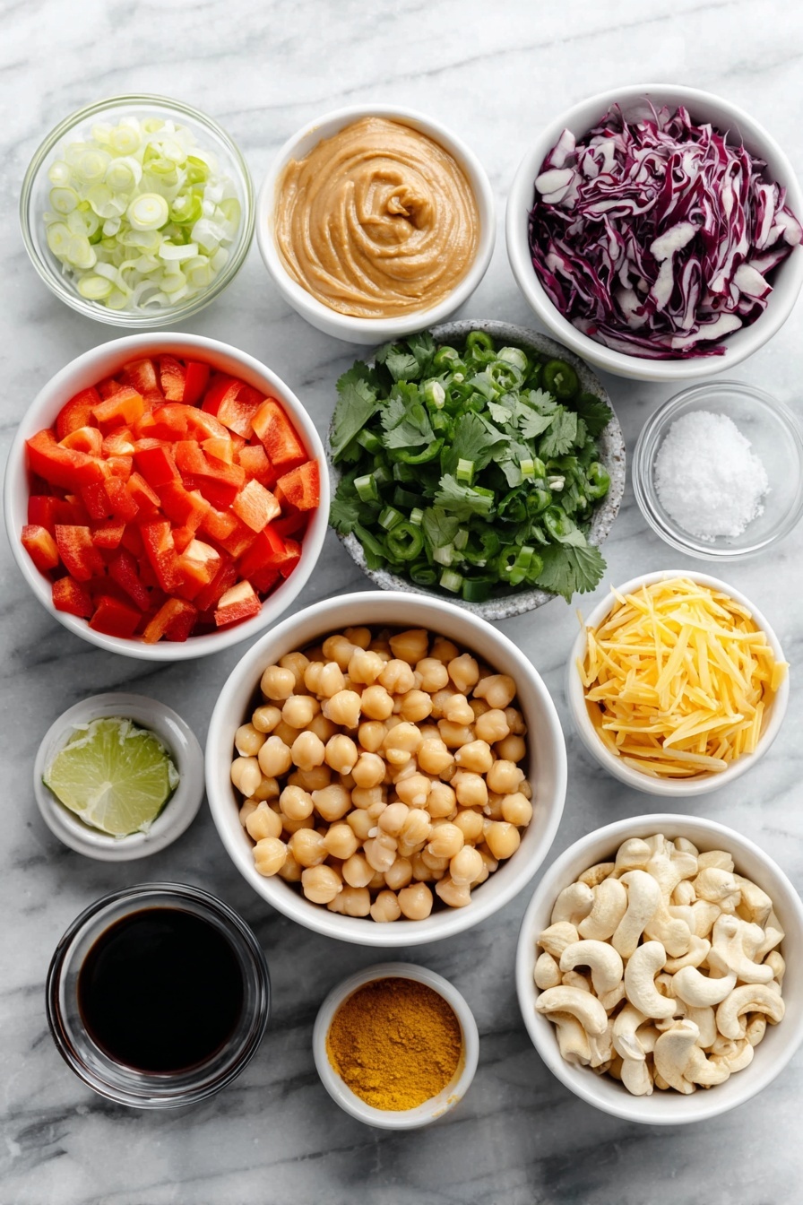 Chopped Thai-Inspired Chickpea Salad with Curry Peanut Dressing, Thai chickpea salad, healthy chickpea salad, Thai-inspired vegan salad, easy plant-based recipes - Flat lay of a diced red bell pepper, a small mound of shredded bright orange carrots, a heap of chopped deep purple-red cabbage, a simple white ceramic bowl filled with plump rinsed chickpeas, a small pile of fresh cilantro leaves, thinly sliced green onions, a whole green jalapeño pepper with seeds visible, a small white bowl of creamy peanut butter, a small white bowl of freshly grated pale yellow ginger, a small white bowl containing minced white garlic, a small white bowl with fresh lime juice, a small white bowl of dark soy sauce, a small white bowl holding vibrant yellow curry powder, a small white bowl of bright red cayenne pepper powder, a small white bowl of golden ground turmeric, a small white bowl of roasted light brown cashews, all symmetrically arranged on a clean white marble surface, soft natural light, photo taken with an iPhone, professional food photography style, fresh ingredients, white ceramic bowls, no bottles, no duplicates, no utensils, no packaging --ar 2:3 --v 7 --p awthu7i m7354615311229779997