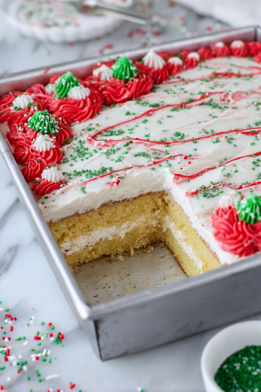 Christmas Tree Sheet Cake with White Chocolate Buttercream, festive holiday cake, Christmas dessert ideas, holiday sheet cake, white chocolate cake recipe - The image shows a square cake in a silver metal pan with a piece taken out from one corner, revealing two layers of golden-yellow cake separated by a thick white cream layer. The top layer of the cake is smooth and covered with white frosting, decorated with thin red lines curving across the surface, green sugar sprinkles scattered evenly, and clusters of red frosting rosettes at the edges with additional green and white sprinkle pieces on top. The pan is placed on a white marbled surface with a small white bowl containing green sugar nearby and some scattered red, green, and white sprinkles around. photo taken with an iphone --ar 2:3 --v 7