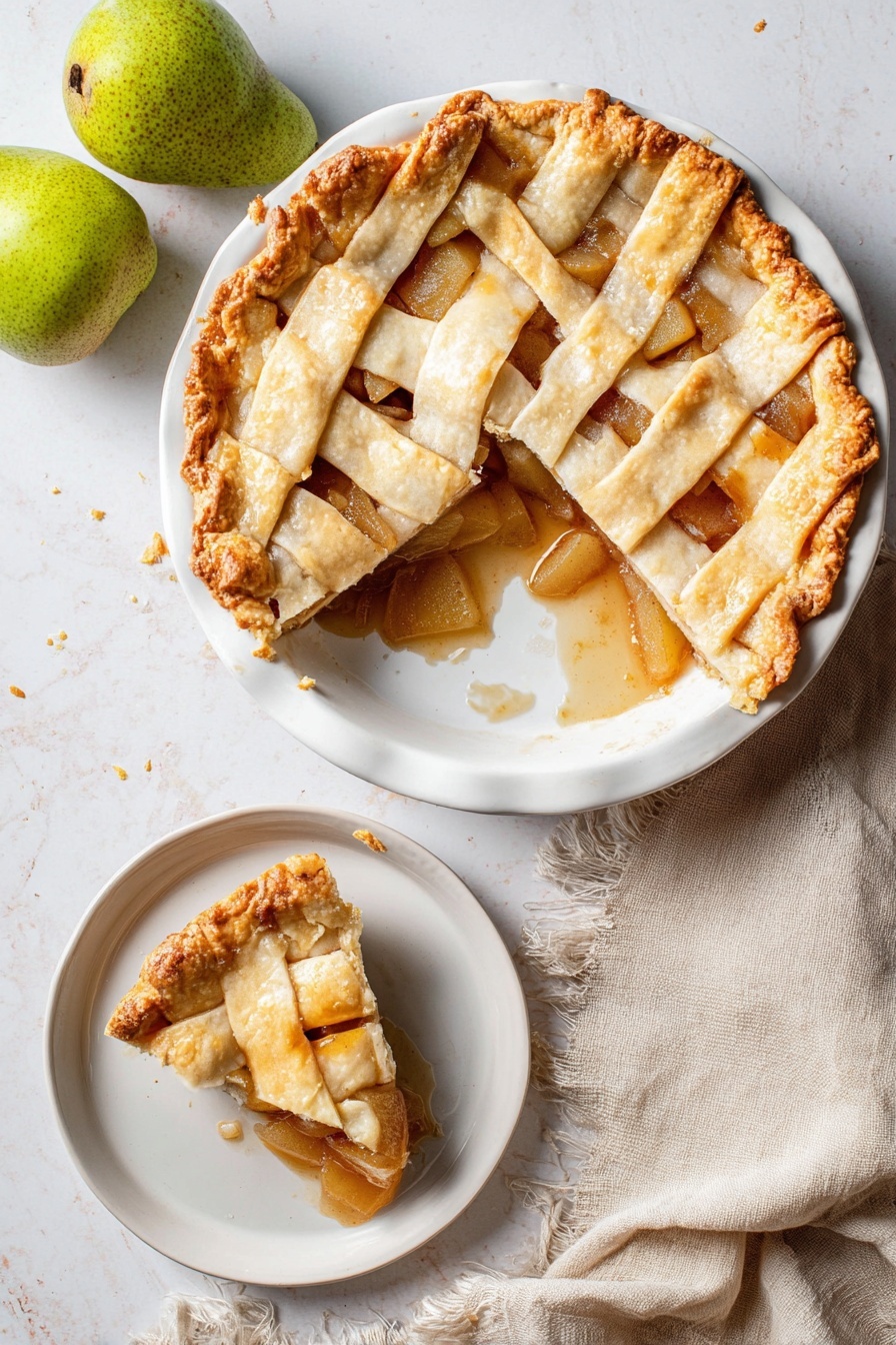 Vegan Pear Chai Spice Pie, vegan pear pie with chai spices, cozy vegan dessert recipes, plant-based fruit pie, vegan holiday dessert - A round pie with a golden brown lattice crust sits on a white plate, showing a soft, slightly shiny filling of sliced pears and cinnamon sauce underneath. One large slice is missing from the pie, revealing the thick fruit filling and some sauce spilling onto the plate. The crust edges are crimped with a slightly darker golden tone. Next to the pie is a smaller white dish with a single slice of the pie, showing the same layers clearly. The scene is on a white marbled surface, with two whole green pears in the top left corner and a soft beige cloth napkin with frayed edges near the bottom left. photo taken with an iphone --ar 2:3 --v 7