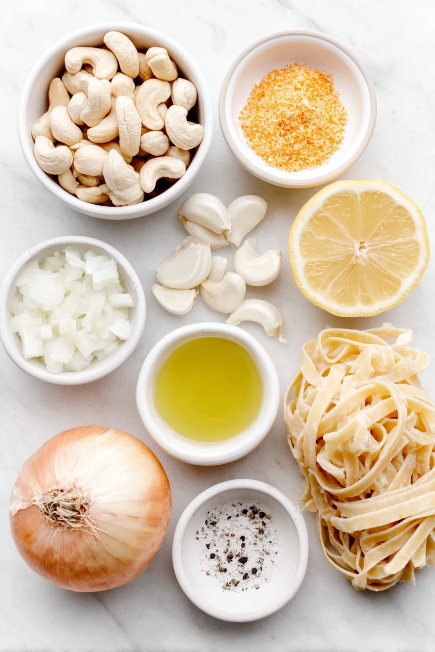 Vegan Cashew Alfredo Sauce, dairy-free Alfredo sauce, plant-based pasta sauce, vegan creamy sauce, vegan Alfredo recipe - Flat lay of raw cashews in a small pile, a small white ceramic bowl of olive oil, half a medium sweet onion with some chopped pieces beside it, several peeled garlic cloves scattered naturally, a small white ceramic bowl filled with unsweetened almond milk, a small white ceramic bowl holding golden nutritional yeast flakes, a fresh lemon wedge next to a small white ceramic bowl containing lemon juice, a small white ceramic bowl of coarse salt, and a neatly arranged bundle of uncooked fettuccine pasta strands, all placed on a clean white marble surface, soft natural light, photo taken with an iPhone, professional food photography style, fresh ingredients, white ceramic bowls, no bottles, no duplicates, no utensils, no packaging --ar 2:3 --v 7 --p m7354615311229779997