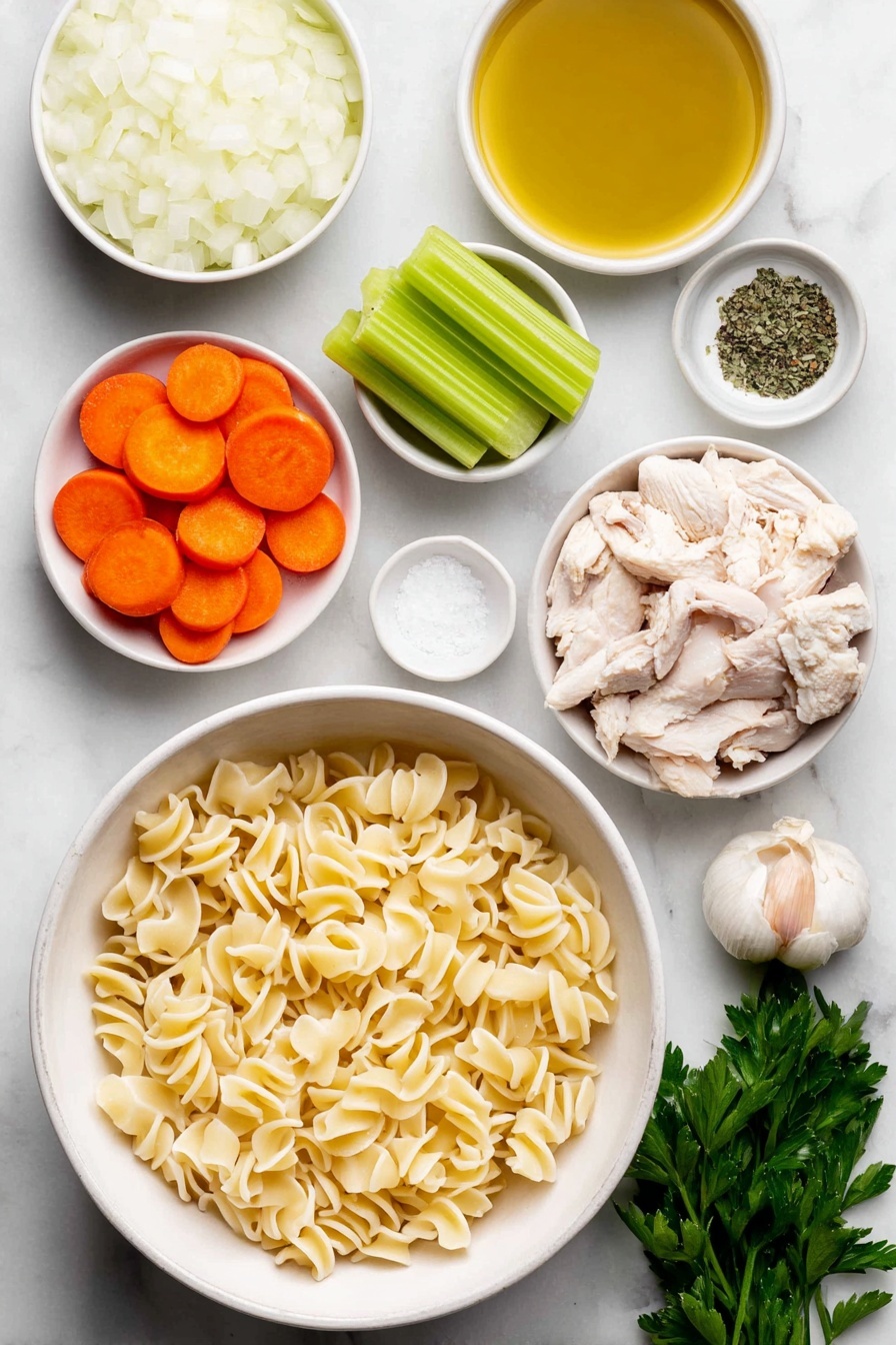 Vegan Chicken Noodle Soup, vegan noodle soup, plant-based chicken soup, vegan comforting soup, dairy-free chicken noodle soup - Flat lay of a small white ceramic bowl of golden olive oil, a large white ceramic bowl filled with chopped white onion, a few cloves of whole unpeeled garlic, three bright green celery stalks sliced, three peeled and sliced vibrant orange carrots, a small white ceramic bowl of dried green basil, a small white ceramic bowl of dried thyme, chopped vegan chicken pieces resembling small beige chunks, uncooked gigli pasta with its twisted funnel shape arranged neatly, a small white ceramic bowl of coarse salt crystals, a small white ceramic bowl of cracked black peppercorns, and a small bunch of fresh green parsley sprigs, all placed on a clean white marble surface, soft natural light, photo taken with an iPhone, professional food photography style, fresh ingredients, white ceramic bowls, no bottles, no duplicates, no utensils, no packaging --ar 2:3 --v 7 --p m7354615311229779997