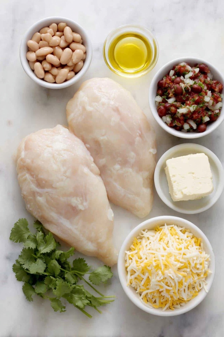 Salsa Chicken Bake, easy weeknight dinner, cheesy chicken casserole, baked salsa chicken, flavorful chicken bake - Flat lay of two large raw boneless skinless chicken breasts, a small white bowl of orange-red taco seasoning powder, a small white bowl of golden olive oil, a block of creamy white cream cheese, a small white bowl filled with smooth light brown refried beans, a small white bowl of chunky red salsa with visible tomato and herbs, a small white bowl with shredded pale yellow cheddar cheese, a small white bowl with shredded white Monterey Jack cheese, and a few fresh bright green cilantro sprigs arranged neatly — all placed on a clean white marble surface, soft natural light, photo taken with an iPhone, professional food photography style, fresh ingredients, white ceramic bowls, no bottles, no duplicates, no utensils, no packaging --ar 2:3 --v 7 --p m7354615311229779997