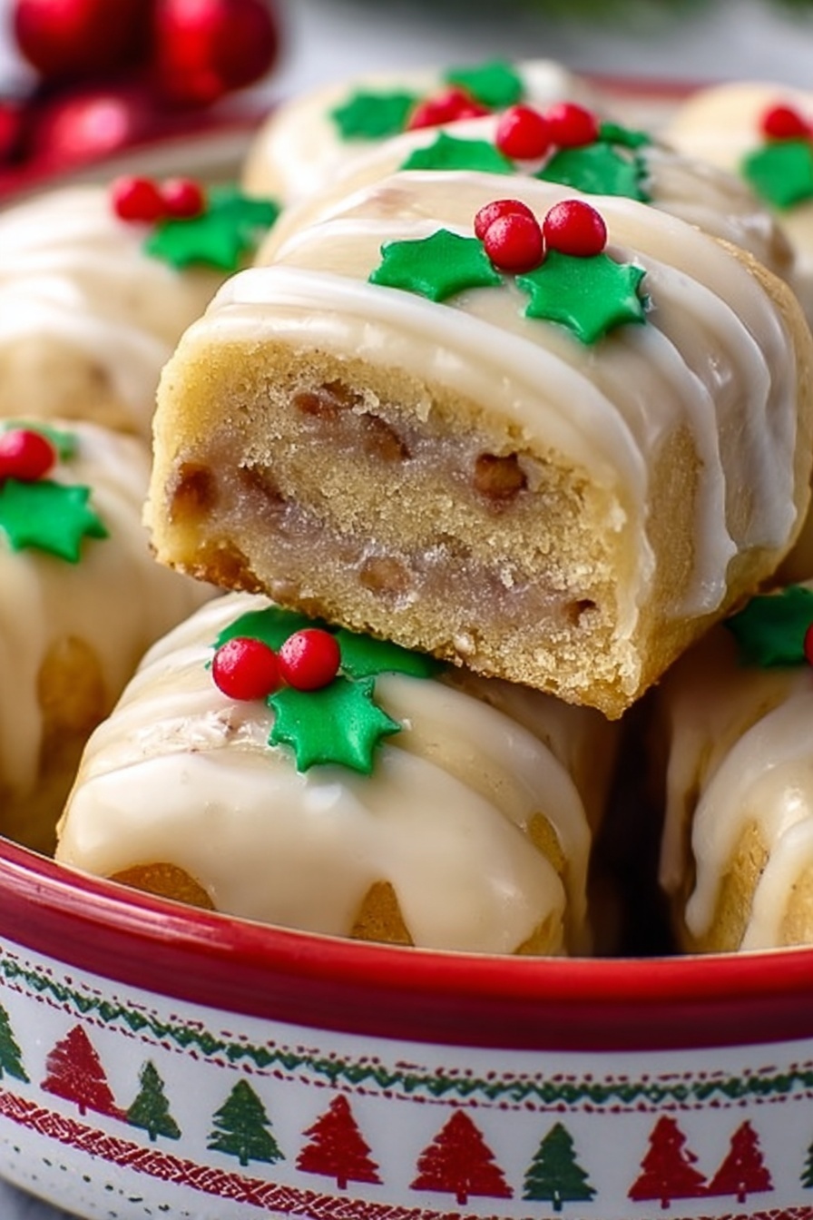 Gingerbread Cookie Log, holiday cookie log, festive gingerbread treats, Nutella lime cookies, seasonal cookie recipes - A stack of square cookies with a light golden color and visible thin layers of a slightly darker filling inside, each topped with a thin, shiny glaze that looks creamy and smooth. On top of the front cookie, there is a small decoration made from green and red icing shaped like holly leaves and red berries. The cookies are placed inside a round white tin with a red pattern of reindeer and geometric shapes around the outside. The background shows more cookies and a white marbled surface beneath the tin. photo taken with an iphone --ar 2:3 --v 7