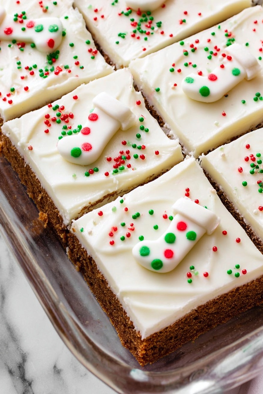 Spiced Gingerbread Cookie Bars, Christmas Dessert Bars, Easy Gingerbread Bars, Holiday Cookie Bars, Warm Spiced Gingerbread Treats - The image shows a baking dish filled with a dessert cut into six square pieces. Each piece has two visible layers: a thick brown crumbly base and a thick smooth white frosting layer on top. The frosting is neatly spread with soft swirls and is decorated with small red, green, and white round sprinkles scattered evenly. Each piece also has a small white candy shaped like a Christmas stocking, decorated with red and green dots. The dish is placed on a white marbled surface. photo taken with an iphone --ar 2:3 --v 7