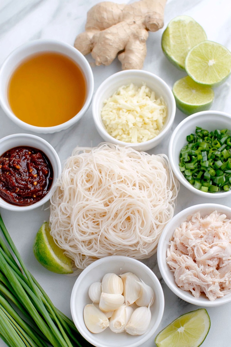 Thai Chicken Curry Soup, Thai Chicken Curry, Chicken Curry Soup, Coconut Curry Soup, Easy Thai Soup - Flat lay of a small white ceramic bowl of golden olive oil, a small white ceramic bowl with finely chopped pale yellow onion, a small white ceramic bowl holding grated fresh ginger with light beige fibrous texture, three whole uncracked garlic cloves with smooth white skins, a small white ceramic bowl filled with vibrant deep red Thai curry paste, a small white ceramic bowl of clear chicken broth with a warm amber tint, a small white ceramic bowl with fresh pale green lime juice, an uncooked bundle of thick 3mm rice noodles with delicate white translucent strands, a small white ceramic bowl of creamy white coconut milk, a small white ceramic bowl with shredded cooked chicken showing tender white and light brown pieces, a small pile of fresh bright green torn basil leaves, a small pile of chopped fresh vibrant green cilantro, a small pile of chopped fresh green scallions, and a few wedges of fresh lime with bright green rind and pale juicy flesh arranged in perfect symmetry, all placed on a clean white marble surface, soft natural light, photo taken with an iPhone, professional food photography style, fresh ingredients, white ceramic bowls, no bottles, no duplicates, no utensils, no packaging --ar 2:3 --v 7 --p m7354615311229779997