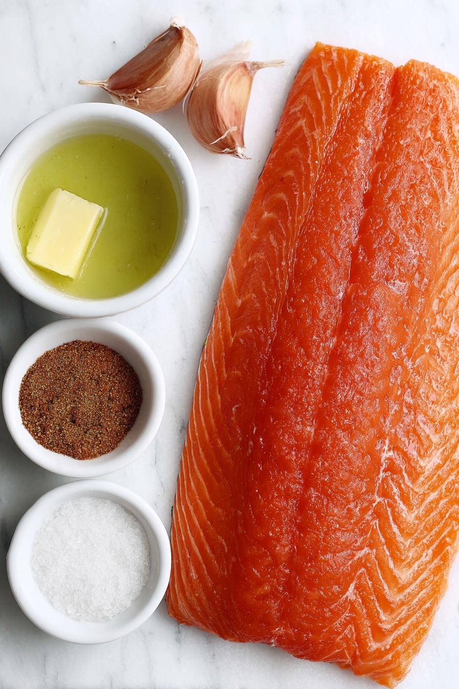 Oven Baked Salmon, baked salmon recipe, easy salmon dinner, healthy salmon dish, flaky salmon fillet - Flat lay of a large whole salmon fillet with skin on, a small white bowl of melted butter, two whole brown garlic cloves, a small white bowl of brown sugar, a small white bowl with a mix of Italian seasoning, ground paprika, garlic powder, salt, and ground black pepper, all arranged with perfect symmetry on a clean white marble surface, soft natural light, photo taken with an iPhone, professional food photography style, fresh ingredients, white ceramic bowls, no bottles, no duplicates, no utensils, no packaging --ar 2:3 --v 7 --p m7354615311229779997
