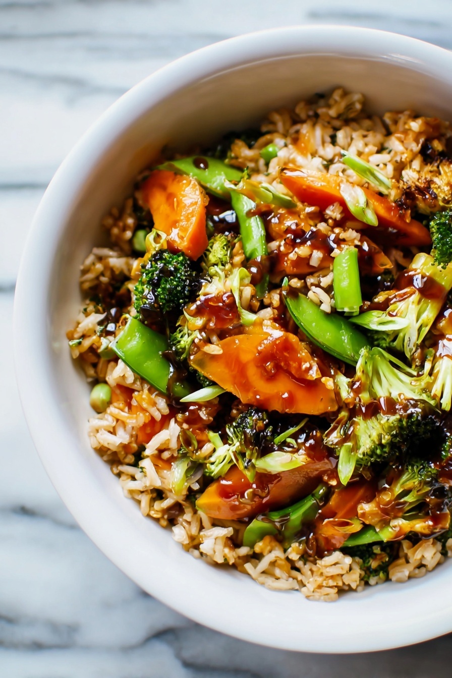 Easy Teriyaki Chicken Casserole, Teriyaki Chicken Bake, Healthy Chicken Casserole, Simple Chicken Dinner, Weeknight Chicken Recipes - The image shows a white bowl filled with a colorful stir-fry dish on a white marbled surface. The dish has three main layers: at the bottom, there is a layer of cooked rice with a light brown color and fluffy texture. The middle layer contains a mix of bright orange baby carrots, green snap peas, and small broccoli florets, giving the dish a fresh and vibrant look. The top layer is a light drizzle of dark brown sauce covering parts of the rice and vegetables, adding a shiny finish. The overall look is warm and inviting, with a mix of soft and crisp textures visible. Photo taken with an iphone --ar 2:3 --v 7